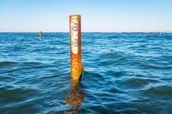Water depth measurement tool or sea level marker.Observation of the water level scale to prevent floods and disasters