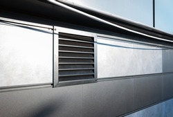 Exhaust grill vent in tiled wall