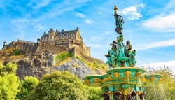 Scenic view of Edinburgh Castle and Ross Fountain, Scotland travel photo. Edinburgh Castle is historic center of the city and most popular tourist attraction.