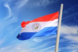 Paraguayan flag against the background of the blue sky