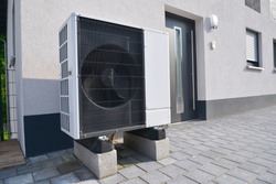 Air-Air Heat Pump for Heating and hot Water in Front of an Apartment Building