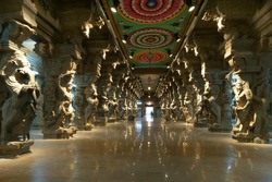 Inside of Meenakshi hindu temple in Madurai, Tamil Nadu, South India. Religious hall of thousands of columns