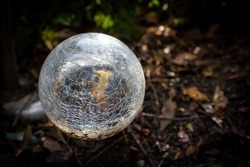 Garden light sphere broken glass on blurred background with copy space