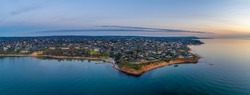 Aerial view of Daveys Bay Yacht Club and scenic coastline at sunset in Melbourne, Australia