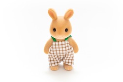 Rabbit doll isolated on white background. Miniature dollhouse toy. Kids toy. Animal character. Play and learn. Kids room. Childhood. Kindergarten toy. Developmental toys. 