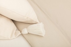 Scandinavian pillow case on the bed. Minimalist object. Scandinavian design. Bedroom. Home decoration. Nordic. Comfortable. 