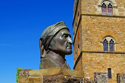 bronze bust of Dante Alighieri located outside the medieval castle of the Conti Guidi a Poppi in the city of Arezzo in Tuscany, Italy