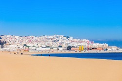 Tangier city beach in Tangier, Morocco. Tangier is a major city in northern Morocco. Tangier located on the North African coast at the western entrance to the Strait of Gibraltar.