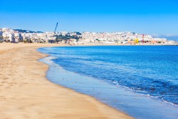 Tangier city beach in Tangier, Morocco. Tangier is a major city in northern Morocco. Tangier located on the North African coast at the western entrance to the Strait of Gibraltar.