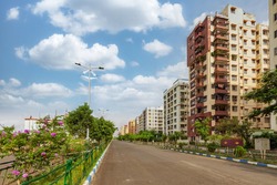 City road with high rise residential apartment buildings at Kolkata India