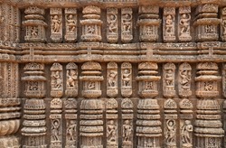 Konark sun temple wall with stone sculptures, carvings and artwork from the 13th century at Puri, Odisha, India
