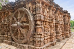 Ancient stone wheel with intricate carvings on the walls of Konark Sun temple at Puri Odisha, India