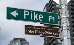 Pike Place Market street sign at  at Pike Place Public Market in Seattle : home to the original Starbucks coffee shop.