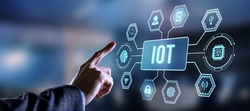 Internet of things - IOT concept. Businessman offer IOT products and solutions. Internet, business, Technology and network concept. Virtual button.