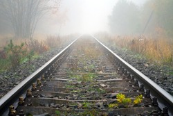 Train rails in foggy weather in Poland