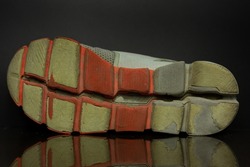 Old and Worn Out Rubber Shoe Soles. It Strange with Orange and grey color.