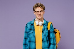Young caucasian boy teen student wear casual clothes backpack headphones glasses isolated on plain pastel light violet background studio portrait. Education in high school university college concept