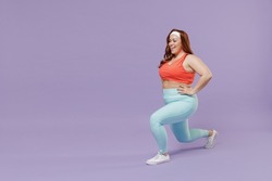 Full length side view happy young chubby overweight plus size big fat fit woman in red top warm up train squating lunges with legs isolated on purple background gym. Workout sport motivation concept