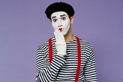 Charismatic confused preoccupied young mime man with white face mask wears striped shirt beret cover mouth with hand doing oops gesture isolated on plain pastel light violet background studio portrait
