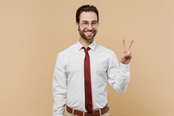 Young fun successful employee business man corporate lawyer 20s wear classic formal white shirt red tie glasses work in office showing victory sign isolated on plain beige background studio portrait