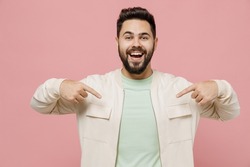 Young surprised exultant jubilant happy fun man 20s wearing trendy jacket shirt point index finger on himself isolated on plain pastel light pink background studio portrait. People lifestyle concept