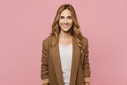 Young satisfied smiling happy fun cheerful successful european employee business woman 30s she wearing casual classic jacket look camera isolated on plain pastel light pink background studio portrait