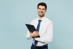 Young fun employee IT business man corporate lawyer wear classic formal shirt tie work in office hold clipboard with paper account documents isolated on plain pastel blue background studio portrait