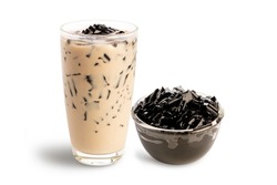 Grass jelly with milk in glass isolated on white background.