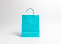 Cyan paper bags on white background.