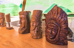 Indian heads statue on wooden table.