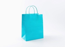 Cyan shopping bag on white background.
