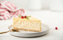 a piece of cheesecake on a white table. space for text