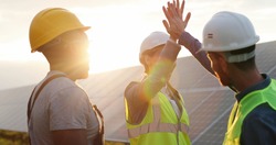 Happy employees of solar power plant raise their hands and shout for joy, clapping each other. People are satisfied with result of their work success.