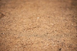 Sharp sand. Construction sand for laying paving slabs. Closeup shot of sand. Sharp sand with a blurred background.