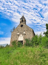 Old small church. Ruins of an old church among the grasses on the mountain