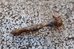 A heavily rusted bolt used for wood