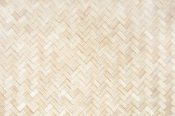 Wicker Thailand light wall. Mat background, bamboo natural texture