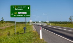 A typical road sign in Queensland Australia, giving directions to the on ramps to the Bruce Highway for drivers to head South to Brisbane or North to the Sunshine Coast.