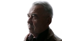 Portrait of old man on white background. Aged male in profile. Free space for text.