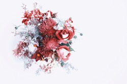 Bouquet of flowers in red, shades of Red Pear, Colors autumn winter 2018. Roses, berries, chrysanthemum, asters, kosmeja, hydrangea, wormwood. Flower composition on white background. Flat lay top view