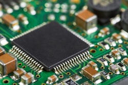 Close-up of computer chip on a part of electronic printed circuit board