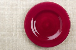 Round ceramic dish on a background mat for the second course.