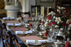fine decorated dining table. Event. Banquet. Celebration. Wedding. Rich silverware. Luxury