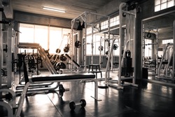 Within gym with modern fitness equipment for fitness events and more. Modern of gym interior with equipment. Sports equipment in the gym.