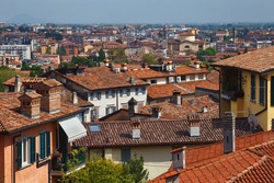 View of the redroof historical buildings in the Bergamo in northern Italy. Bergamo is a city in the Lombardy region. 