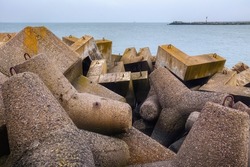 Massive concrete breakwaters on the Baltic Sea coast to protect the coast from the destructive effects of sea waves.