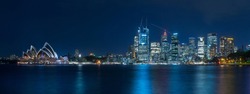 Panoramic view of Sydney city and bridge at night with beautiful reflection.Long exposure shot.