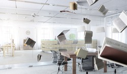 Office workplace with flying objects