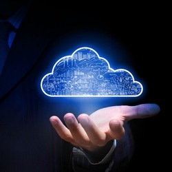 Businessman hand holding cloud computing concept in palm