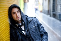 Young attractive man in urban background